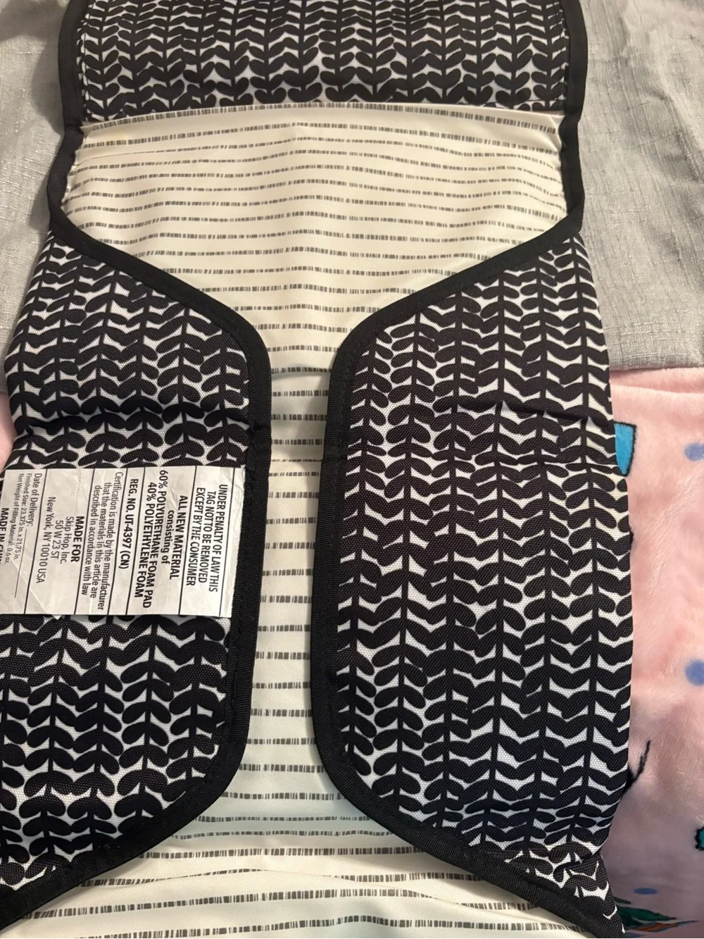Skidaddle by Skip Hop Black & White Travel diaper bag with fold out changing pad